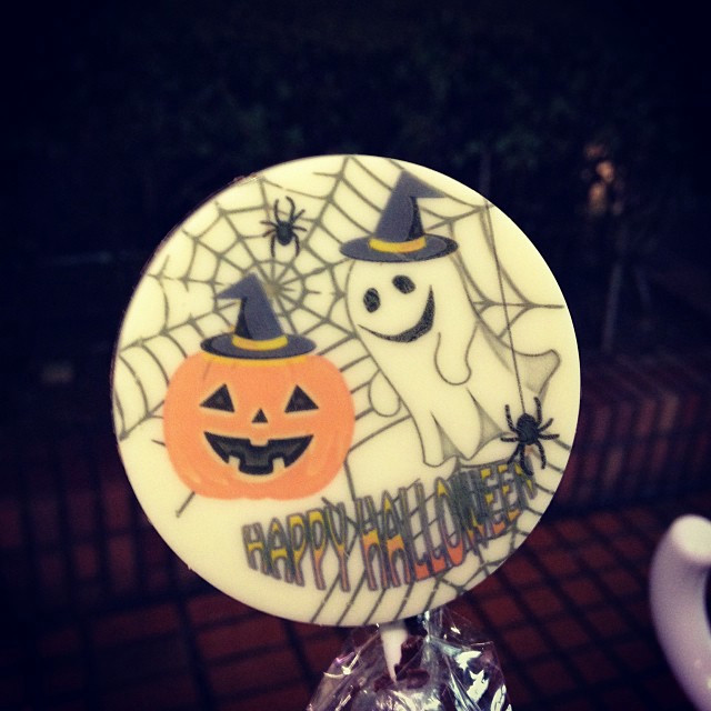     A Halloween candy pop, featuring a ghost and a pumpkin with the words 
    