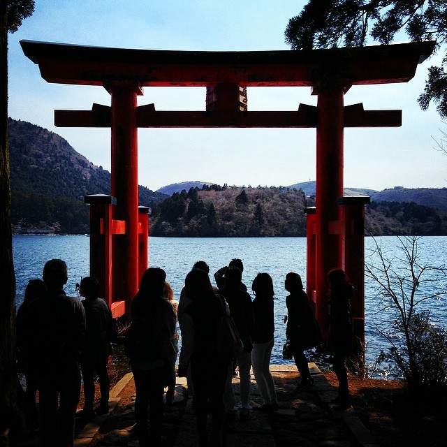 A red torii (gate) on the water.