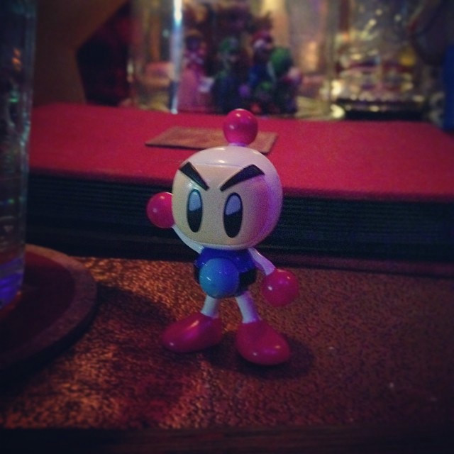 A Bomberman (videogame character) figurine. White with blue accents.