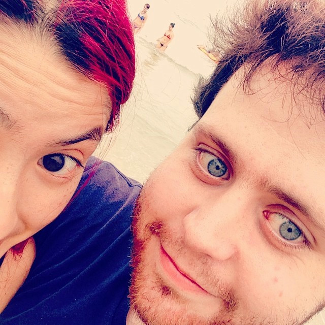 My girlfriend and I in a selfie photo near the water.