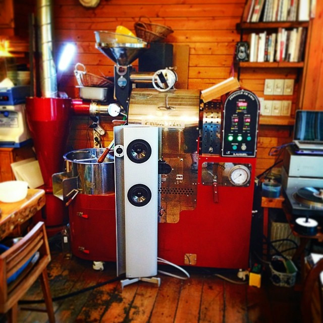 A small bright red coffee cart.