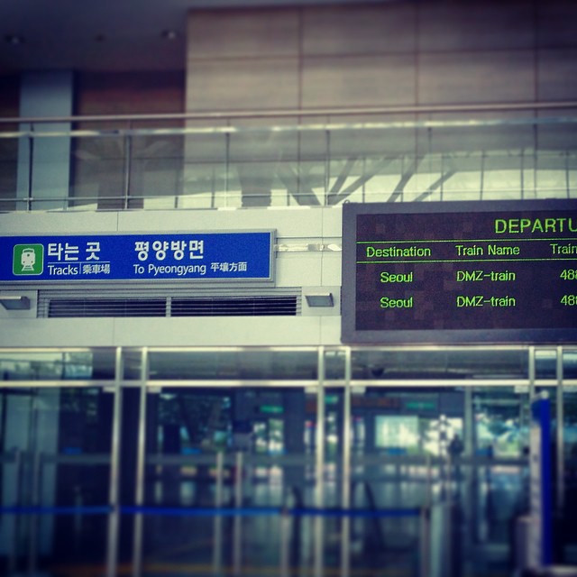 A train entrance listing the direction as Pyeongyang, North Korea.