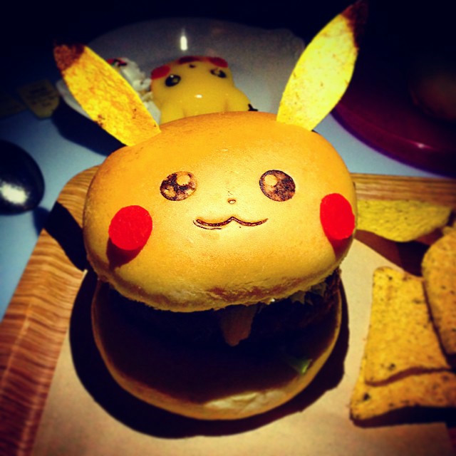 A burger, but the bun is made to look like Pikachu from Pokemon.