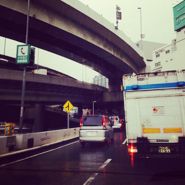 A packed freeway, with a truck taking up most of the view.