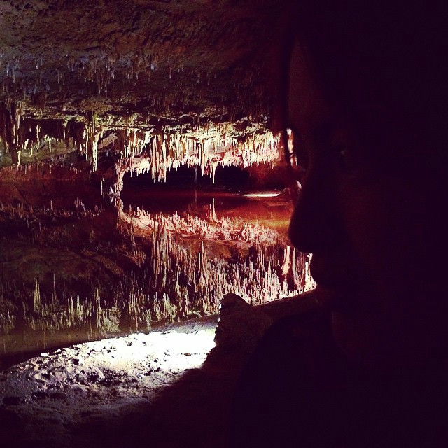 A deep shot of Luray Caverns, where the lighting makes it look like an alien cave. Girlfriend is off to the right.