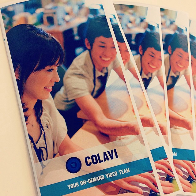 A brochure for a tech company (Colavi) that acts an an on-demand video team. Two staff members are working on a computer on the front.