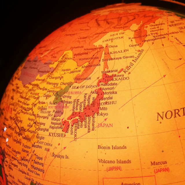 A close-up of a glowing globe. The photo is centered on Japan.