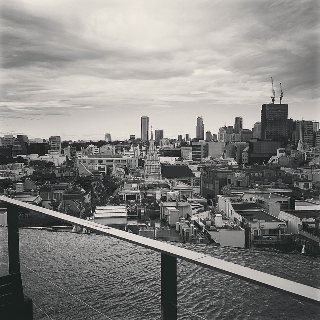 Grayscale photo of the Tokyo skyline from Omotesando.