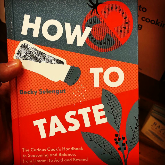 A photo of the book cover of 'How to Taste' by Becky Selengut. It's orange and black and features a stylized salt shaker.