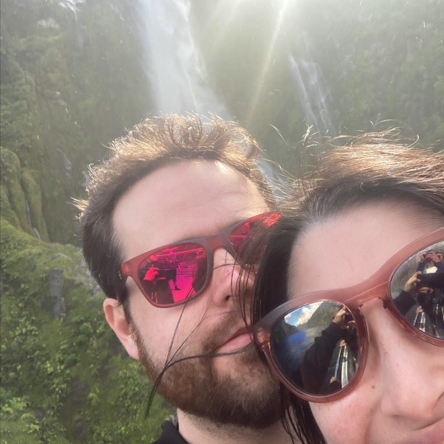 Me and my wife posing for a selfie on a boat.