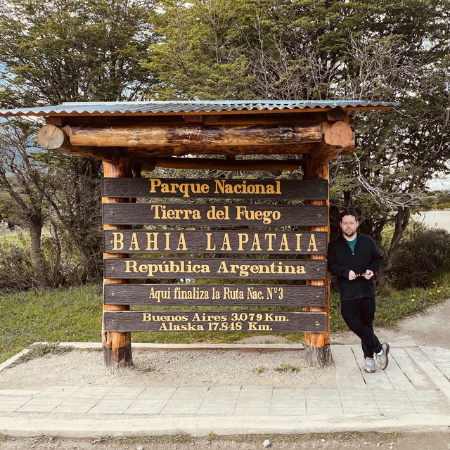 Me standing next to the sign marking the end of the Pan-American Highway in Argentina.