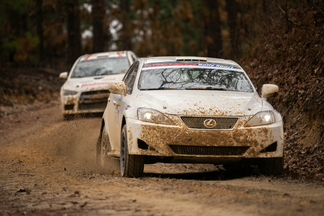 A white Lexus IS250 is chased by a competitor.