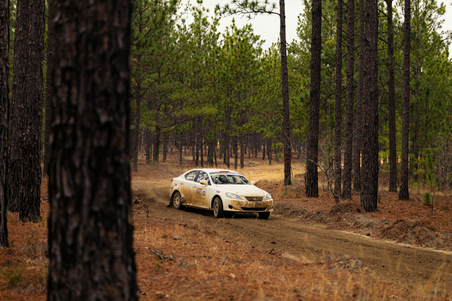 A white Lexus IS250 racing through the sandy woods of South Carolina.