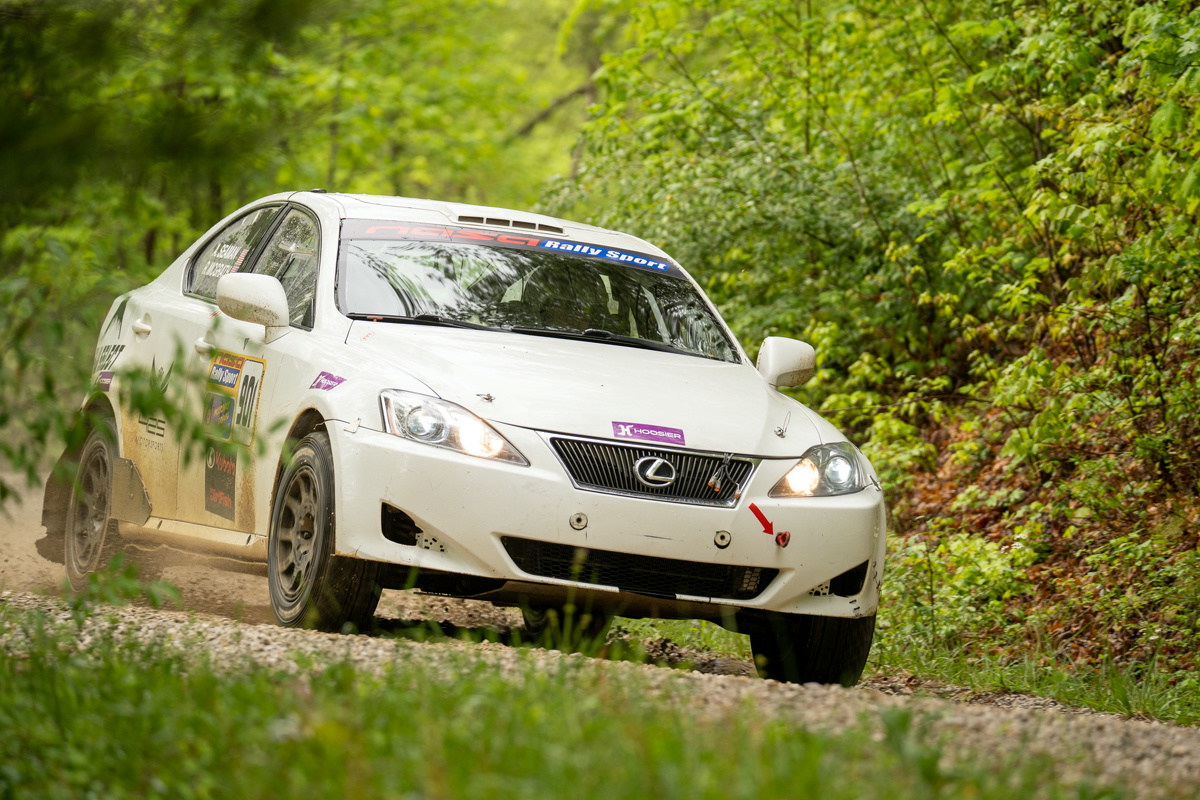 A white Lexus IS250 powering around a stage road.