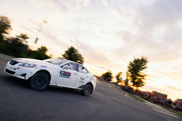 A white Lexus IS250 drifting around in a demo run.